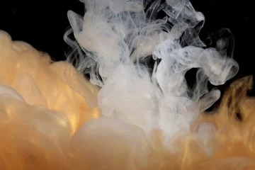 Fotobehang Abstract soft focus blur smoke background. Ink colors blot in water. Yellow, gold, black tone. © Liliia