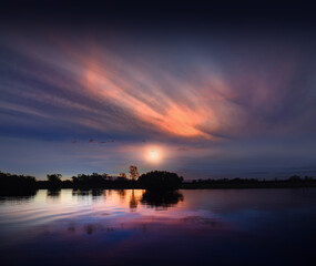 spectacularly and colorful sunset at Yellow Waters Billabong, Kakadu National Park, Northern Territory, Australia
