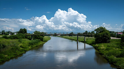 Picturesque River Crossing Over Wooden Bridge Under Blue Sky And Fluffy White Clouds During Summer Day