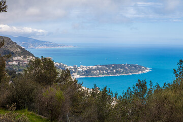 A beautiful view of the see with a small island in the distance