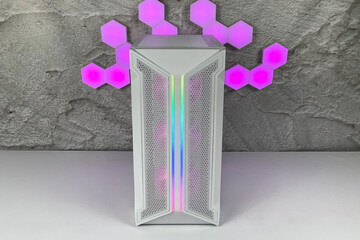 A white CPU casing with rgb fans and colorful bright rgb rainbow led lighting