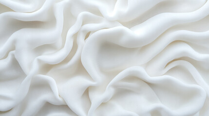 Obraz premium A close-up of flowing white fabric with soft folds and a smooth texture, creating an abstract minimalistic design.