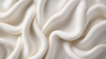 Obraz premium A close-up of flowing white fabric with soft folds and a smooth texture, creating an abstract minimalistic design.