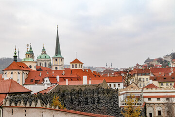 A cityscape of Prague Czech Republic with a large red roof on a building