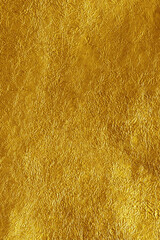A background pattern showcasing a harmonious blend of colors, including yellow, gold, beige, tan, and brown. This fabric design likely exhibits textures or motifs that complement the warm tones