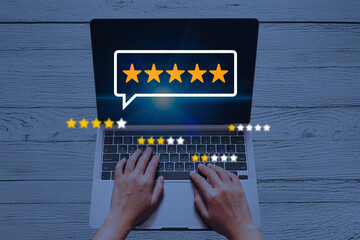 User Giving a Five-Star Online Review and Rating on Digital Platform Using Laptop