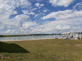 summer lake, wooden swing, beach, tent, deck chairs, white clouds, blue sky, reflection, forest
remote, grass, summer, vacation, walk, tourist
