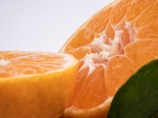 Close-up of orange fruit against white background

