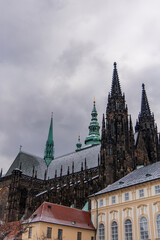Fototapeta premium St. Vitus Cathedral rising over Prague Castle on a cloudy winter day