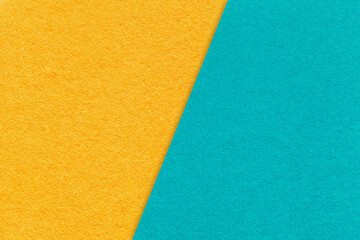 Fototapeta premium Texture craft yellow and cerulean paper background, half two colors, macro. Structure vintage kraft turquoise cardboard.