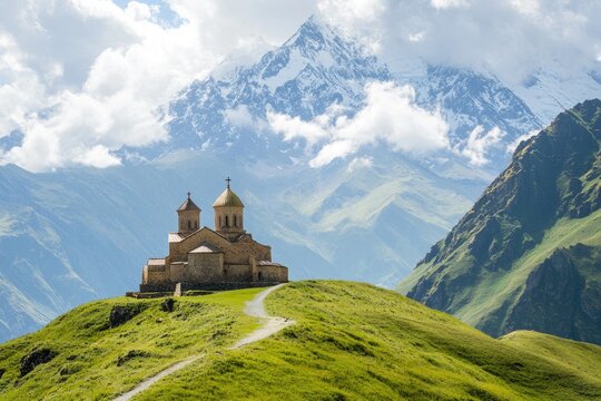Scenic View of Tsminda Sameba Monastery in Kazbegi, Georgia: A Cultural Gem Surrounded by Majestic Caucasian Mountains