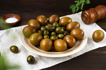 Easter eggs painted with natural dyes on a plate close-up