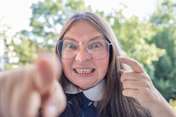 furious mature woman glares, showing anger, rage and frustration, Threatening expression on Female...