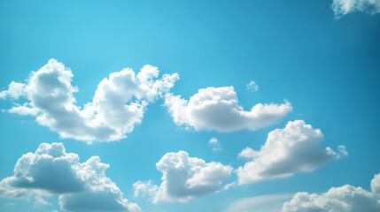 A bright blue sky with fluffy white cumulus clouds, making for a serene and airy background