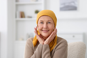 Portrait of senior woman with cancer at home