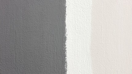 Fototapeta premium Neutral paint shades blending across textured wall surface, forming minimalist geometric pattern with soft grey, white, and beige color gradations