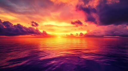 Fototapeta premium A beautiful sunset reflects its vibrant colors over the ocean water
