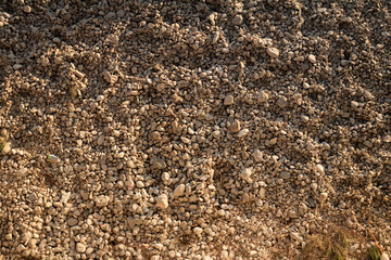 A peaceful scene of beach rocks against the backdrop of a stunning sunset. 