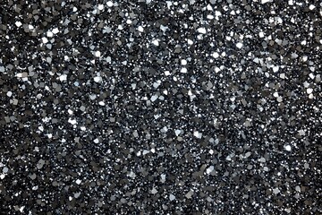 Sparkling Black and Silver Glitter Texture Background for Luxury and Festive Designs