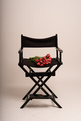 black director's chair with flowers