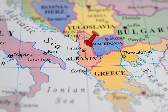 Colorful tourist location map with red stick pin at  Tiana, Albania, and the surrounding countries