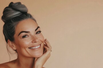 Portrait of a happy woman with gray hair styled in a bun, radiating confidence and joy. Generated AI