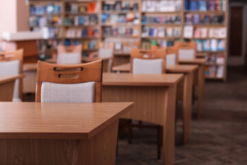 Desks and chairs in public library room