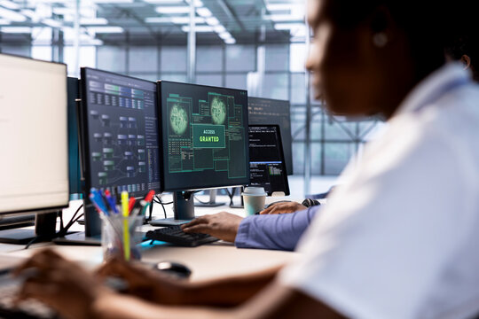 Computer scientist receives access granted notification while reconfiguring server hub, optimizing it. IT expert ensures data center workplace operates efficiently, successfully eliminating all errors