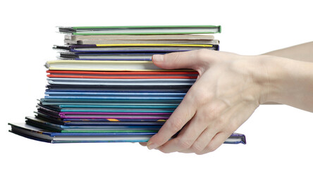 Hand holding colorful stacked books on white background isolation
