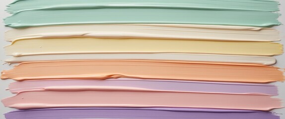 Samples of various color correcting concealers on a backdrop