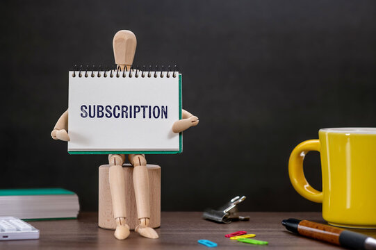 There is notebook with the word Subscription. It is as an eye-catching image.