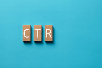 There is wood block with the word CTR. It is an abbreviation for Click Through Rate as eye-catching...
