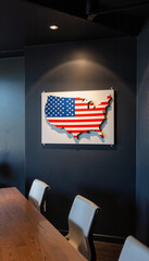 USA map in flag colors on dark wall in modern office, patriotic decor