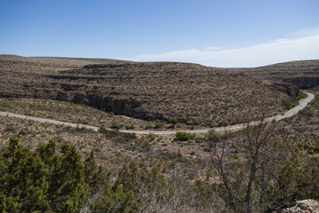 Naklejka premium Two-lane road through Carlsbad Caverns National Park, New Mexico