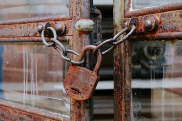 Rusty Padlock on a Mausoleum Door