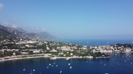 Aerial view of a serene harbor with boats on tranquil water