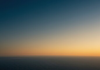 Obraz premium Tranquil dawn horizon over serene ocean with gradual sunrise