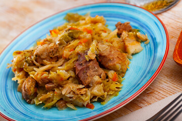 Traditional tasty Polish dish Bigos from braised sauerkraut with pork meat