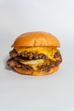 Delicious Smash Burgers on White Background &ndash; With Grilled Onion