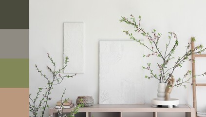 Table and vase with blooming tree branches in light room. Different color patterns