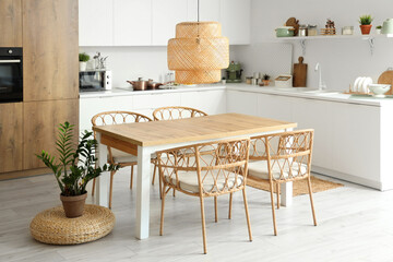 Clean wooden table in interior of modern kitchen