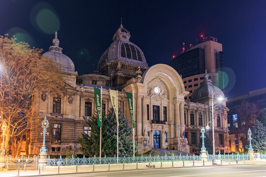 Night view of cec palace in bucharest with illuminated architecture and starry sky. March 8, 2025 Bucharest Romania