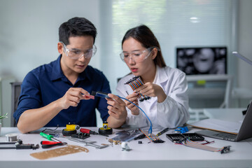Two people are working on a project together