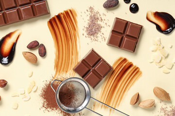 Composition with sweet chocolate, cocoa beans and nuts on color background