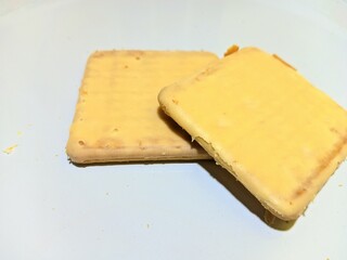 close up view of cheese filled biscuits on white background