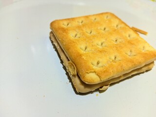 close up view of cheese filled biscuits on white background
