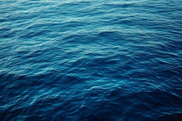Fototapeta premium Tranquil Deep Blue Ocean Water Surface with Gentle Ripples Capturing the Essence of Serenity and Movement in Nature