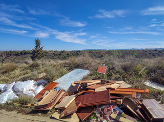 Furniture and sacks lying around in nature