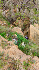 gully clogged by dumped rubbish
