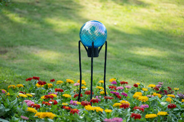 gazing ball in the zinnias